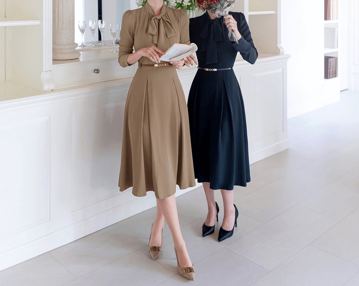Women wearing elegant ribbon neck pleated flare dresses in navy and beige, showcasing a classic, flattering silhouette.