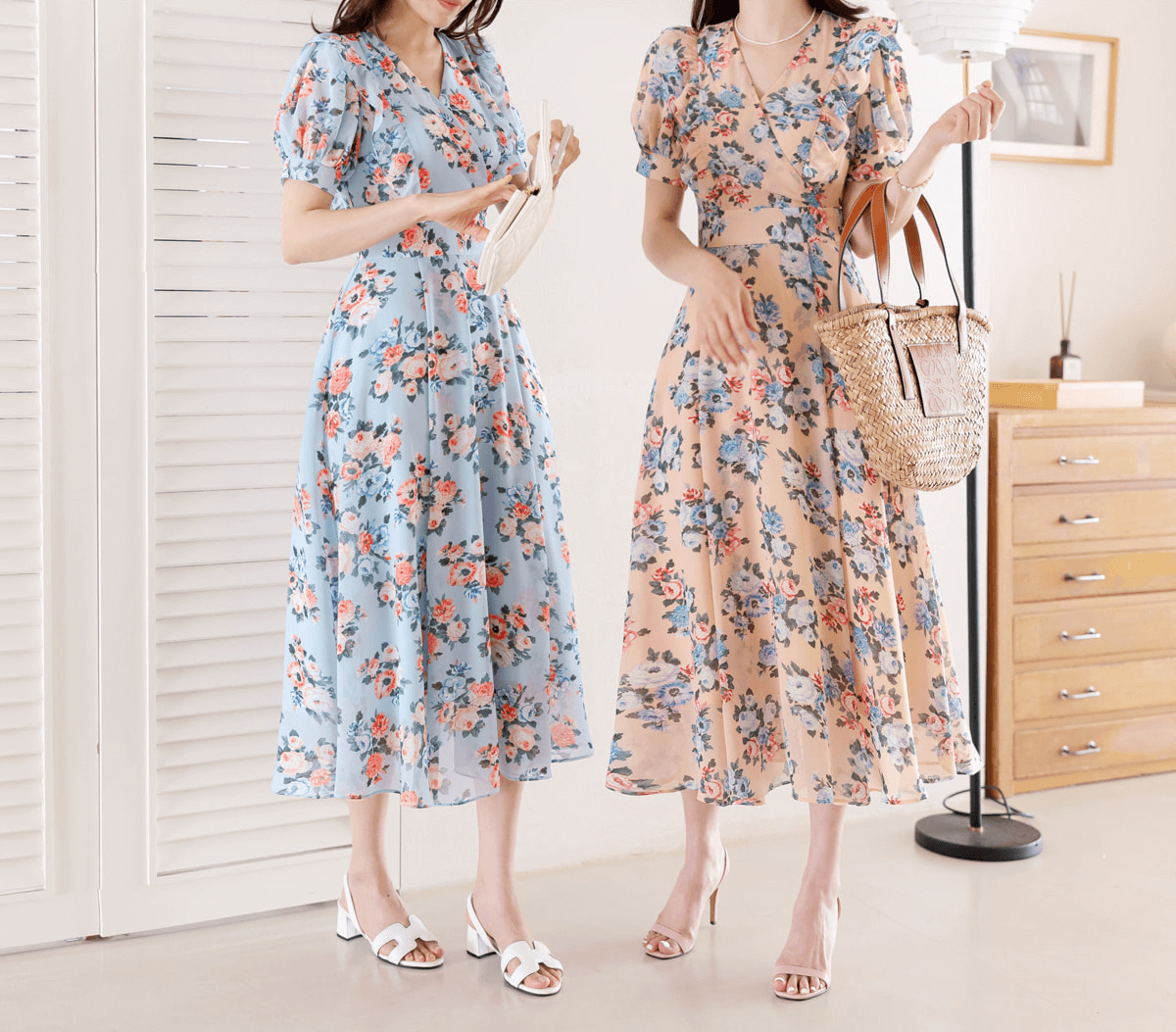 Women in floral chiffon dresses with short puff sleeves and V-neckline, available in pink and blue, standing indoors.