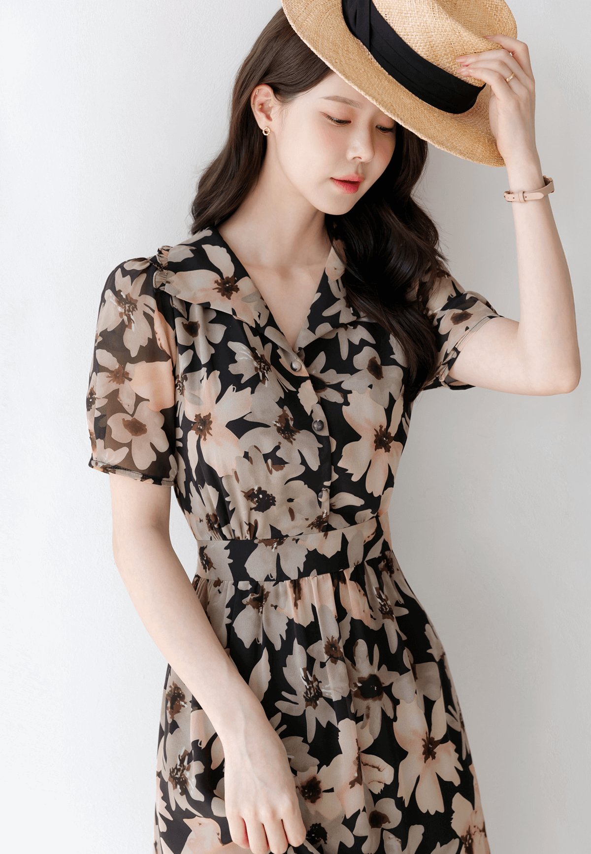Floral chiffon dress with wide collar and puff sleeves; feminine and airy design enhancing movement and style.