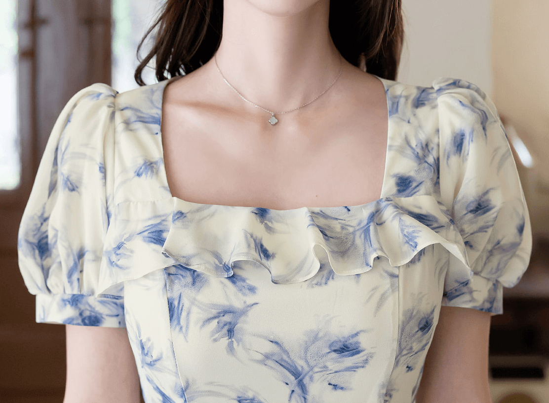 Elegant chiffon dress with blue-violet abstract print and square ruffle neckline
