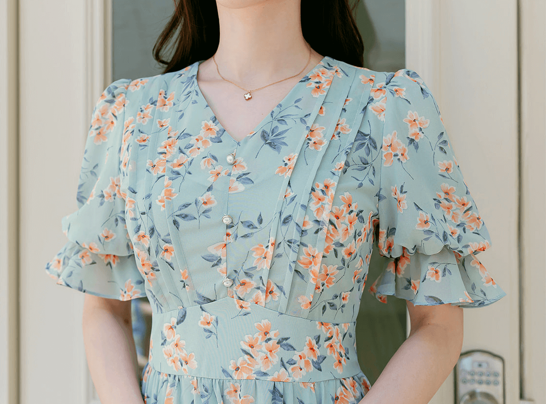 V-neck puff sleeve floral chiffon dress in breezy blue with orange flowers, flattering spring summer style.