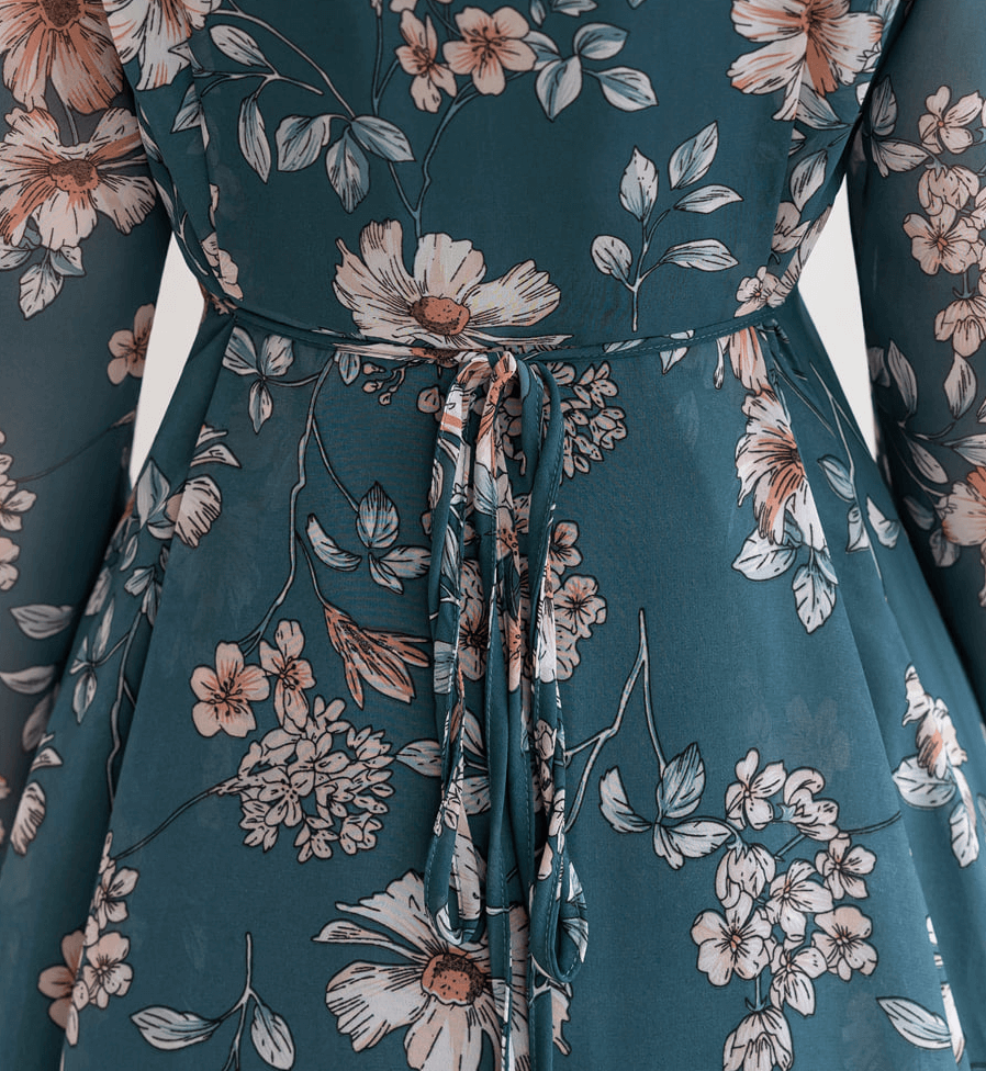 Back view of floral chiffon flare dress showing intricate floral pattern and thin side ties for adjustable fit.
