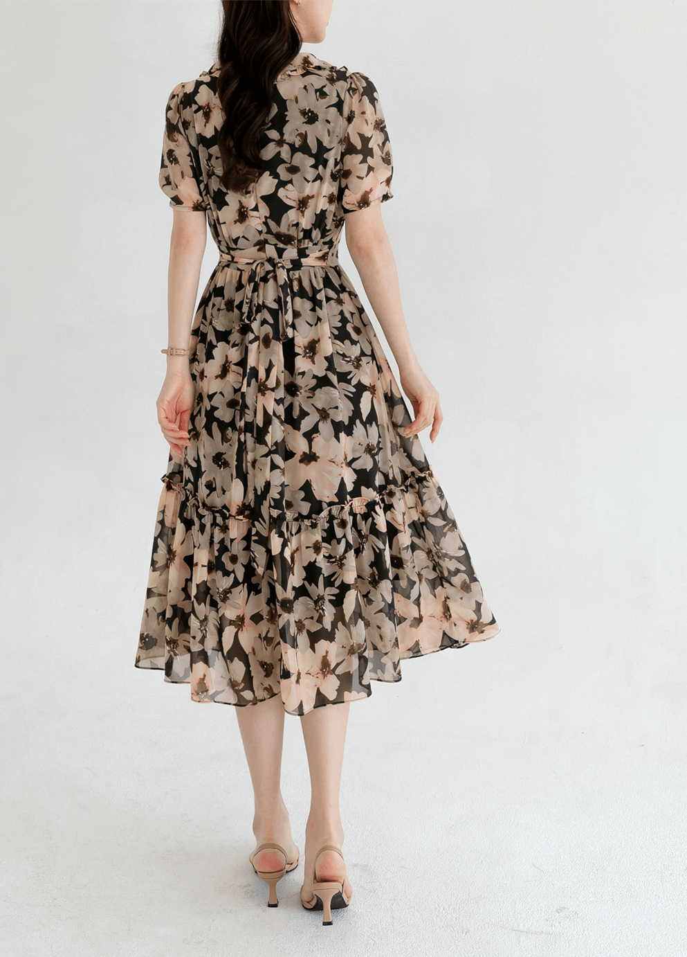 Floral chiffon dress with wide flat collar and puff short sleeves, cinched waist, and flowing silhouette, embodying feminine elegance.