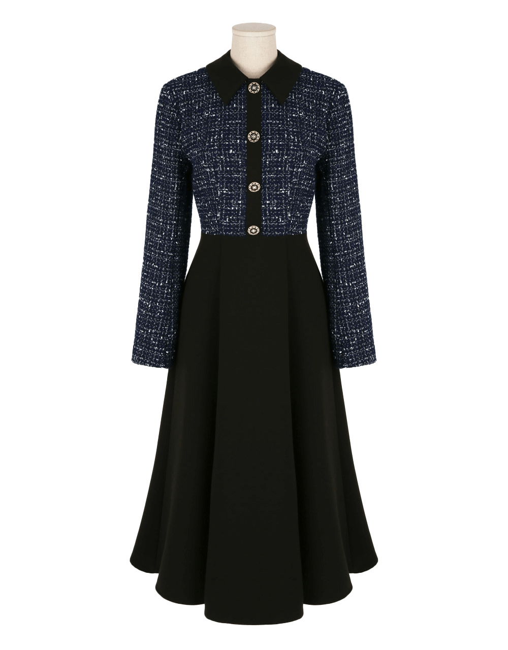 Two-tone navy tweed and black flare dress with gold button detail, featuring a classic elegant design.