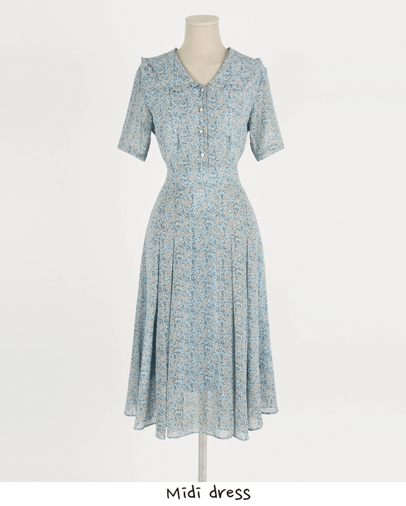Romantic floral chiffon dress with frill collar, short sleeves, and waist ribbon detail, perfect for elegant warm-weather occasions.