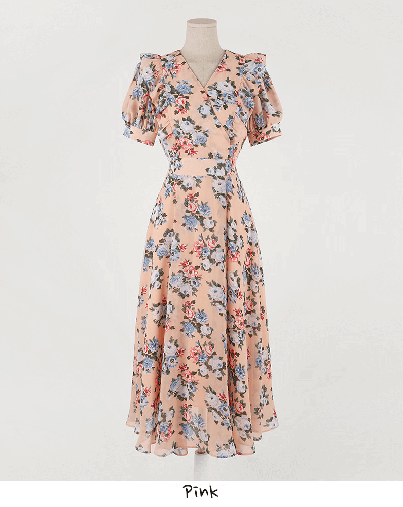 Pink floral chiffon dress with short puff sleeves and V-neckline displayed on mannequin.