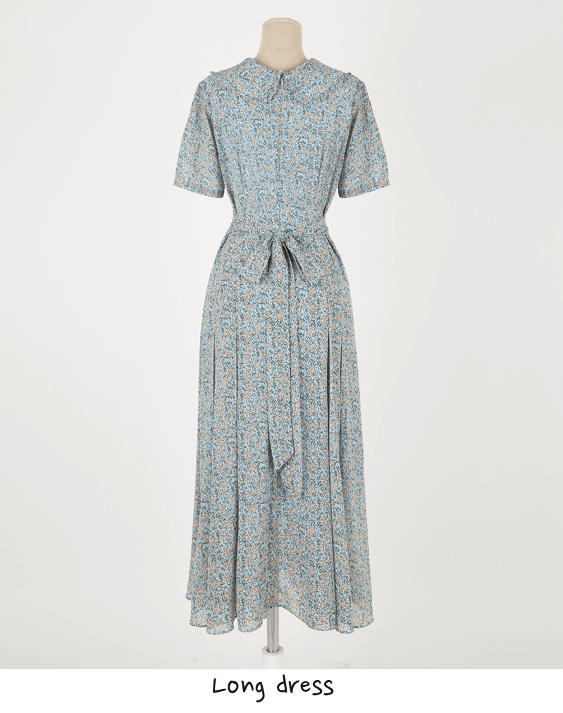 Romantic floral chiffon dress with frill collar, short sleeves, and waist ribbon detail on a mannequin, perfect for warm occasions.