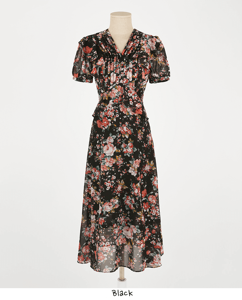 Floral chiffon dress in black with pintuck bodice, peplum waist, V-neckline, and puffed sleeves for everyday elegance.