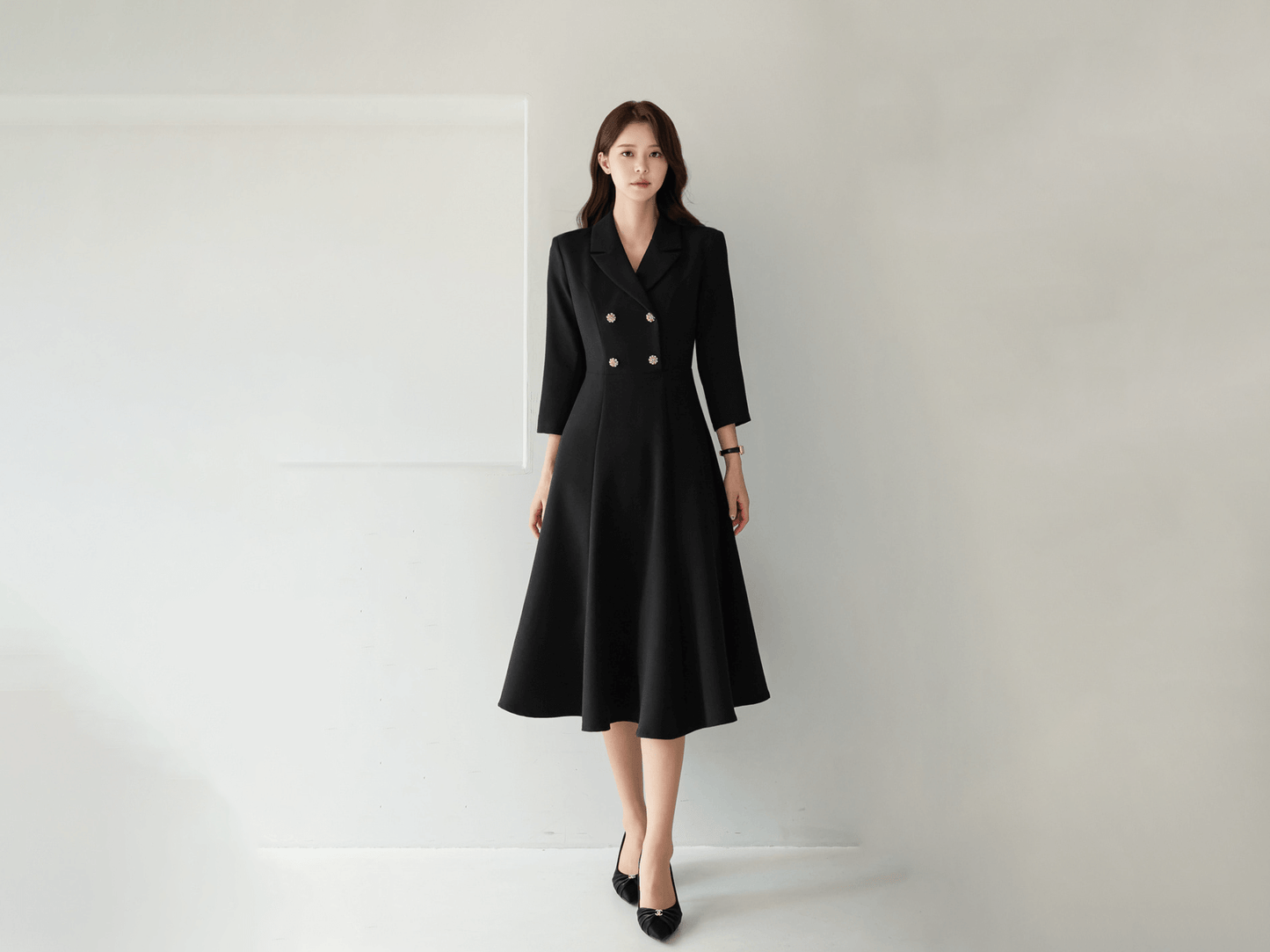 Classic black flare dress with collar and double-breasted buttons