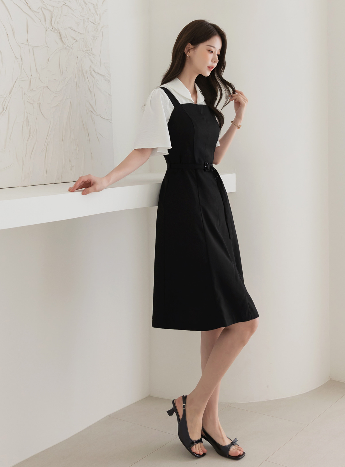 Modern Sleeveless Black Dress with Waist Belt and Side Pockets