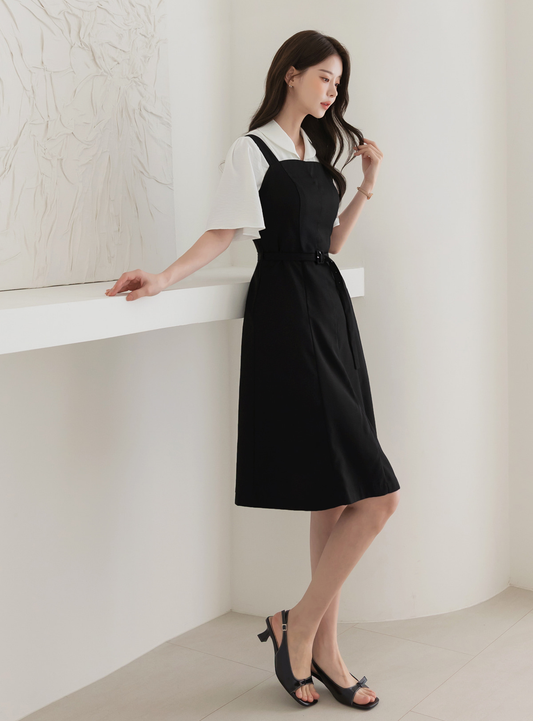 Modern Sleeveless Black Dress with Waist Belt and Side Pockets
