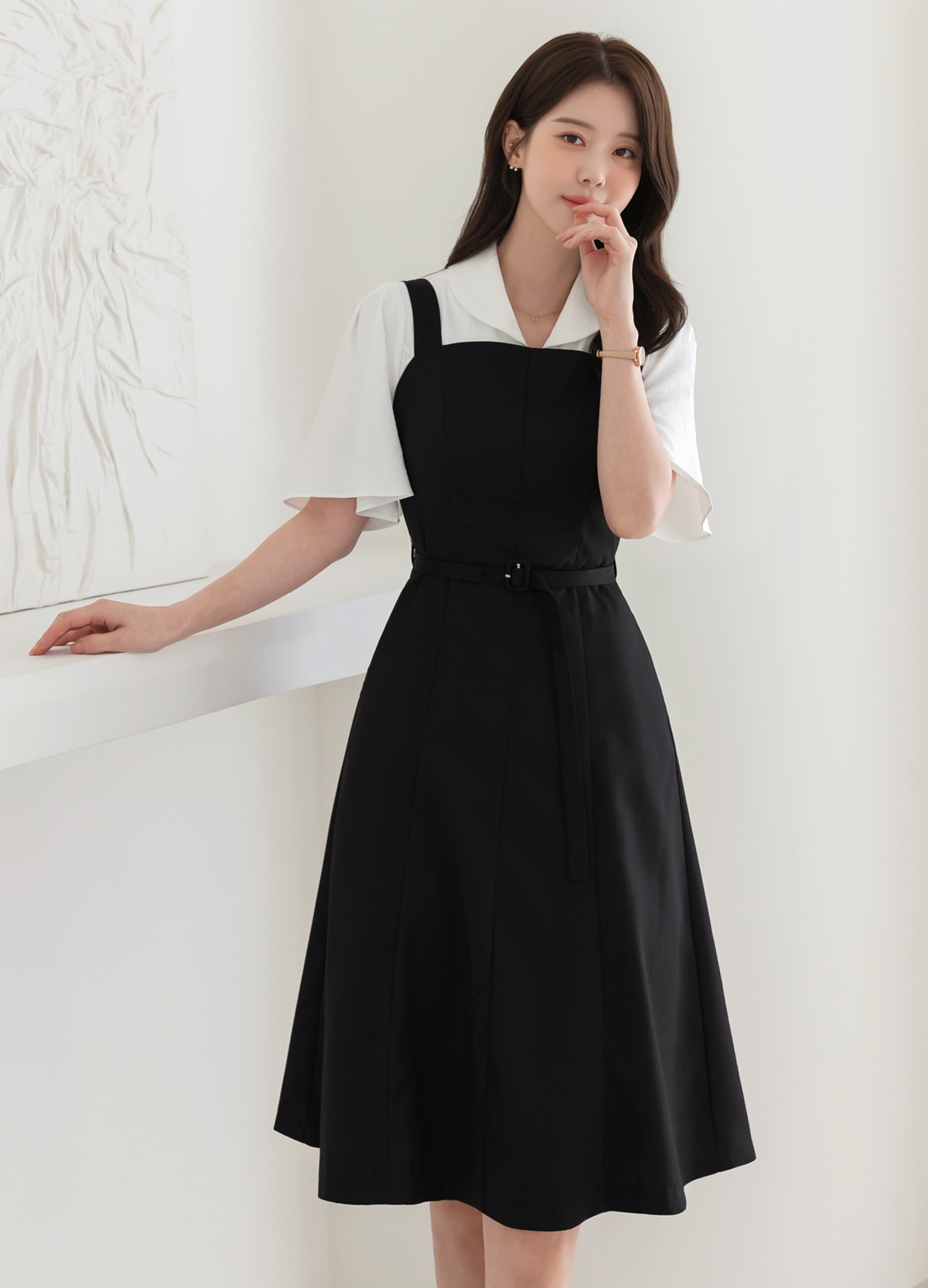 Modern Sleeveless Black Dress with Waist Belt and Side Pockets