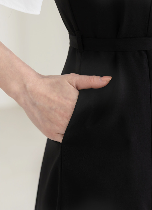 Modern Sleeveless Black Dress with Waist Belt and Side Pockets