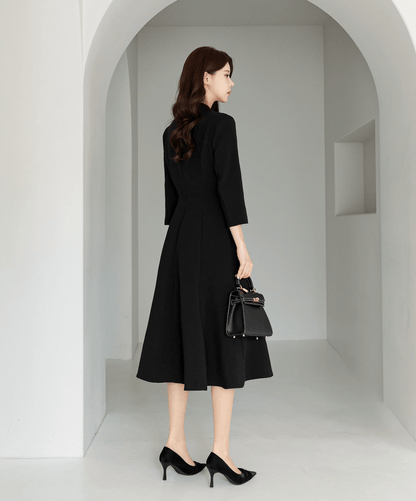 Classic black flare dress with collar and double-breasted buttons
