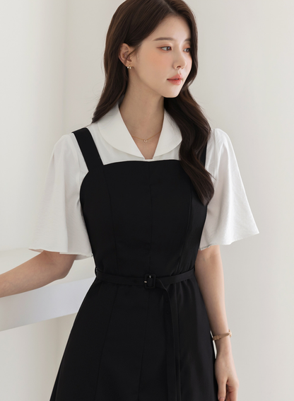 Modern Sleeveless Black Dress with Waist Belt and Side Pockets