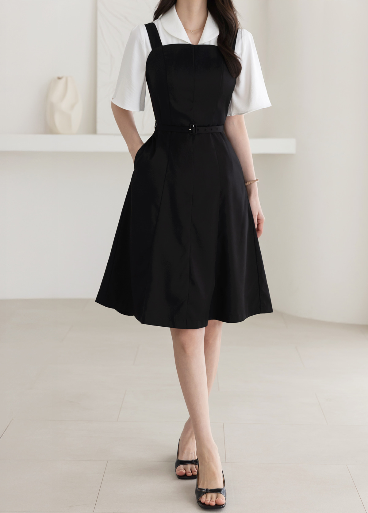 Modern Sleeveless Black Dress with Waist Belt and Side Pockets