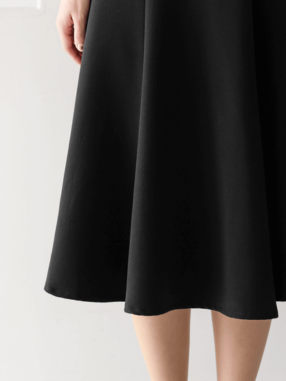 Classic black flare dress with collar and double-breasted buttons