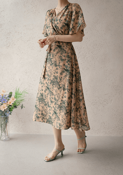 Goddess-inspired wrap dress with graceful wing sleeves, floral pattern, and adjustable ribbon tie for an elegant look.