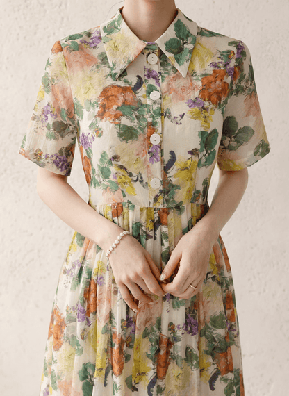 Romantic floral dress with pintuck detail and collar neckline, soft flare silhouette, delicate floral print, elegant fashion.
