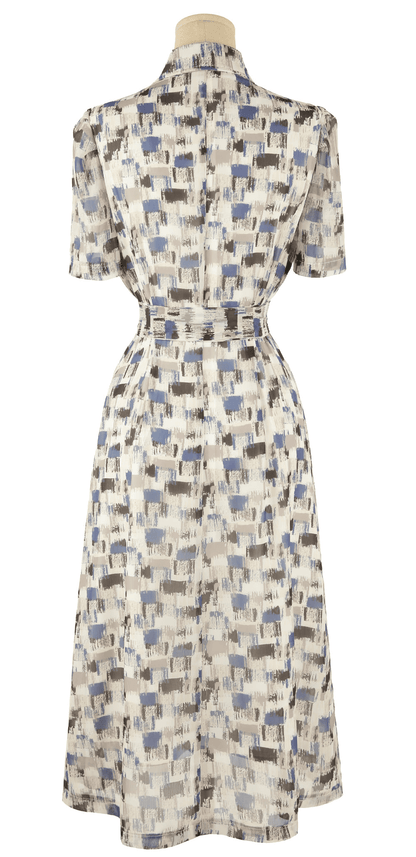 Breezy chiffon shirt dress with blue abstract pattern and belt, short sleeves, and collar neckline, perfect for summer style.